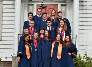 Justin Mattingly ('17), top left, poses with the rest of The Daily Orange Class of 2017 on the steps of 744 Ostrom the morning of commencement on May 14.