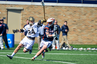 Marcus Cunningham tries to keep the ball away from a Fighting Irish player. 
